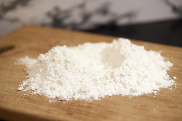 Flour on a wooden board
