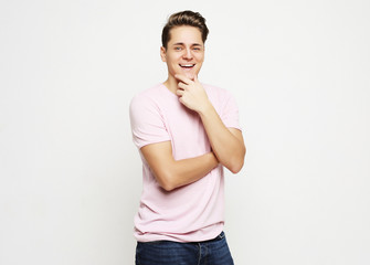 young handsome man, wearing pink shirt.