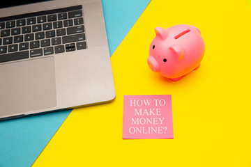 How to make money online - answer on pink sticky note. Concept of passive income.
