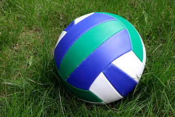 Volleyball ball on a green grass. Ball for sport game