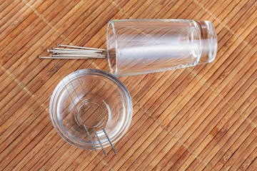 Table with needles for acupuncture. Silver needles for traditional Chinese acupuncture medicine on...