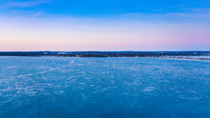 Obraz premium Sunrise over Frozen Lake (drone photo)