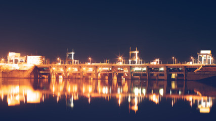 Reflection of night hydroelectric power station in river. Vyshgorod, Ukraine.