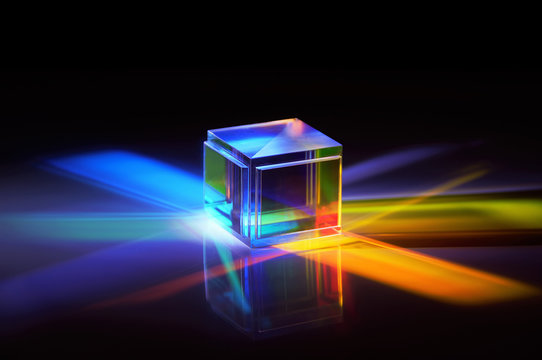 Multicolored Rays Of Light Reflected By A Crystal Cube 