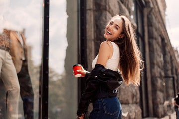 Graceful cute girl in casual clothes enjoying leisure time on Street.portrait funny joyful attarctive young women having fun, smiling