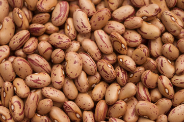 Close up from above of a pile of pinto beans as background or texture