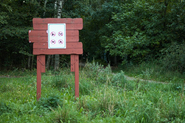 White blank sign board in the green park
