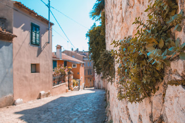 Fototapeta na wymiar Empty street in the old town of Rovinj, Istrian Peninsula in Croatia. The town is a popular tourist destination in summer