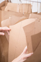 woman hands molds clothes brown