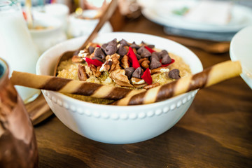 Healthy breakfast with cereal, oatmeal, with coconut, chocolate