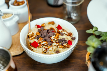 Healthy breakfast with cereal, oatmeal, with coconut, chocolate