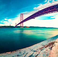 Places of interest in Lisbon, Portugal. Bridge of April 25 and sunset.Portuguese architecture and landmark