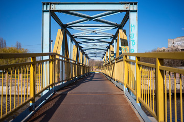 yellow blue pedestrian metal bridge, metal bridge construction