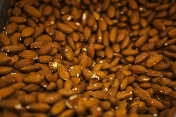 Lots of almonds on the counter in the store.