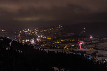Fototapeta na wymiar New Year's fireworks seeing from above 