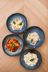 Variety tasty red and white pasta in a bowl top view. Photography best use for commercial magazine or restaurant’s book menu.