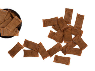 Open can of smokeless tobacco with pouches on white background