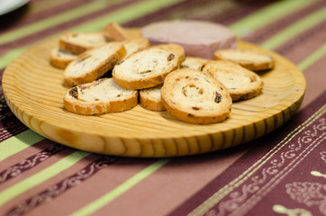 Pate board with raisin buns.