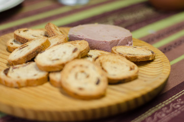 Pate board with raisin buns.