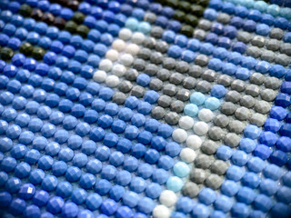 Close-up, colorful round diamond embroidery bright. Hobbies and entertainment.