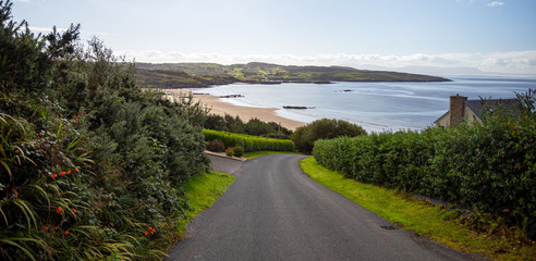 Fototapeta na wymiar Fintra Beach, Co Donegal. Ireland April 2019. A road leads to a beautiful unspoilt beach on a sunny day in County Donegal