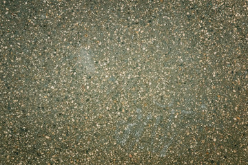Toned photo of asphalt with small stones. Background for sites and layouts