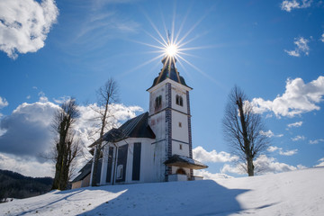Fototapeta na wymiar Church on the top of Bukov vrh hill in winter