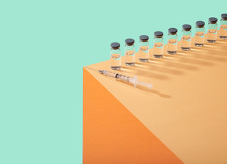 Corona Virus Covid 19 Vaccine Cure in Vial on Counter Table Top
Single vial lined up on edge of table surface  bright bold colors