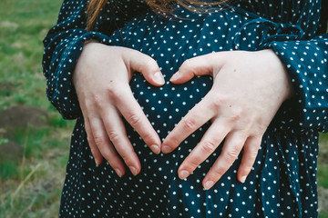 Pregnant Woman Holding Hands on Her Belly