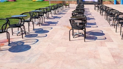 Empty restaurant outdoor terrace tables waiting for new customers after global pandemic ending....