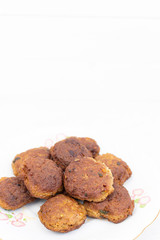 Fried meatballs served on the plate with white background