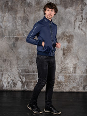 Obraz premium Full length studio portrait of attractive young man. Young Male Fashion Model Posing In Casual Outfit. 