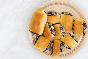 Flatlay above Poppy seeds cookies served on the plate