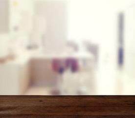 wood table on blur modern living room interior background - can used for display or montage your products