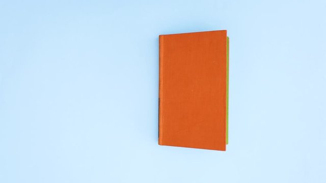Orange book appear and open - Stop motion 