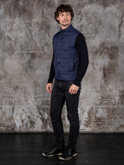 Full length studio portrait of attractive young man. Young Male Fashion Model Posing In Casual Outfit. 