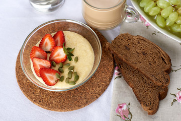 breakfast of cereal and fruit with coffee