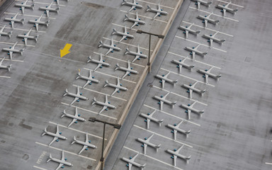 Lockdown of flights concept: Composite image of a parking lot shot from above and 3d rendered...