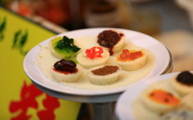 Closeup of Chinese pastry on white plate, Chinese street food