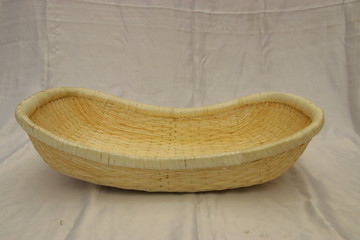 Empty boat shape wicker basket isolated. Bread, fruit storage container