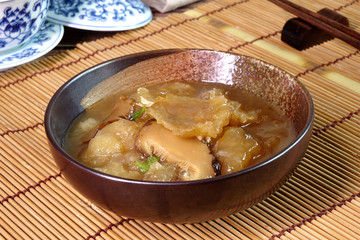 Braised Fish Maw in Red Gravy, famous Hakka cuisine in China, Hong Kong, Taiwan, Thailand. In Chinese food culture, fish maw is a type of food that promotes longevity or wondrous health benefits.