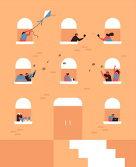 People in leisure time at apartment balcony window