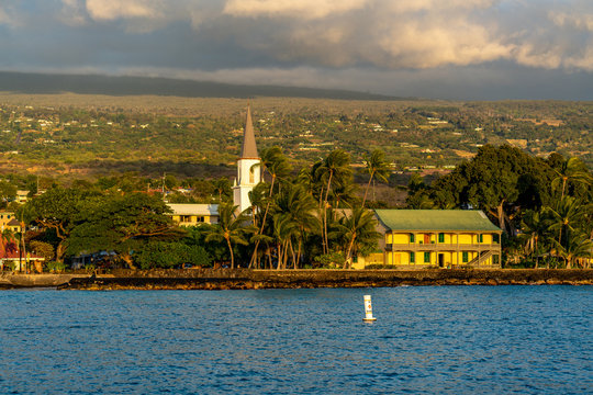 Kailua Village in downtown Kailua-Kona on the Big Island of Hawaii from Kailua Bay, circa 2019.
