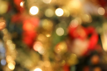 Blurred Background of Christmas Tree Lights with lots of green Bokeh Holiday