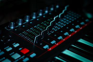 Obraz na płótnie Canvas Audio Mixing Board on a Keyboard with Volume Sliders for music industry