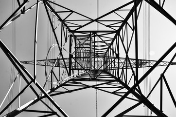 black and white high voltage pylon looking up