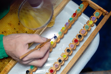 Larva of bee, selected for growing queen bee. Tool for picking larvae from honeycombs on a frame....