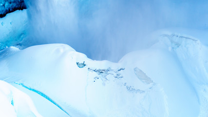 Close up of the spectacular ice and snow cone in winter at the bottom of Helmcken Falls on the...