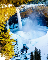 Helmcken Falls on the Murtle River in winter with the spectacular ice and snow cone at the bottom. In Wells Gray Provincial Park near the town of Clearwater, British Columbia, Canada