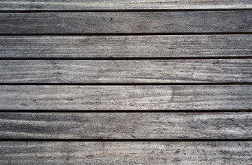 weathered wooden planks of seaside dock for background and texture